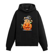 Cadı şapkası takmış, balkabağının içinden çıkan sevimli ayıcık baskılı hoodie tasarımı.