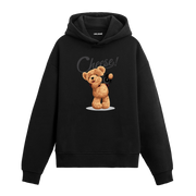 Elinde fotoğraf makinesiyle gülümseyerek poz veren ayıcık baskılı hoodie tasarımı.