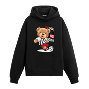 Futbol topuna vuran, “One Goal Is Not Enough” yazılı futbolcu ayıcık baskılı hoodie tasarımı.