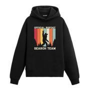 Official Bigfoot Search Team yazılı siyah hoodie – orman ve Bigfoot figürlü retro tasarım