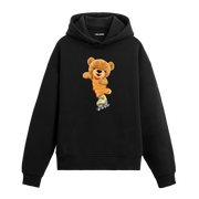 Renkli patenleriyle kayan sevimli ayıcık baskılı hoodie tasarımı.