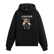 Koltukta oturan, fötr şapkalı ve takım elbiseli gangster temalı ayıcık baskılı hoodie tasarımı.