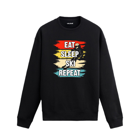 Kayak temalı retro sweatshirt, üzerinde “Ye, Uyu, Kay, Tekrarla” yazısı ve kayak yapan figür baskısı bulunan tasarım.